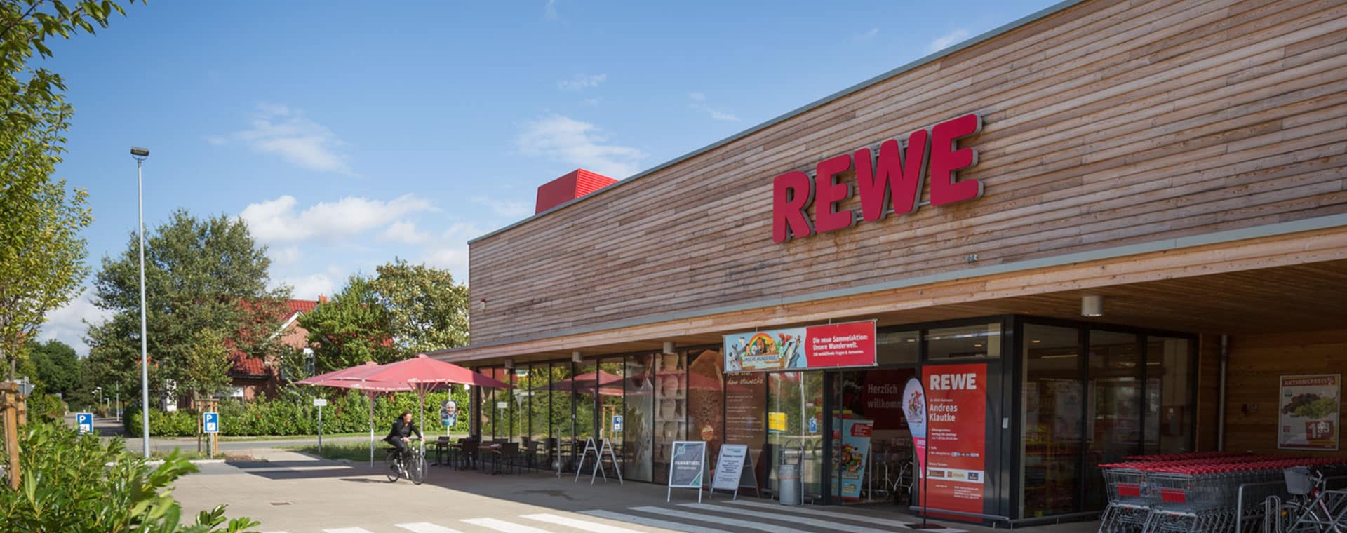 Ein REWE Markt als Symbolbild für Immobiliengesuche
