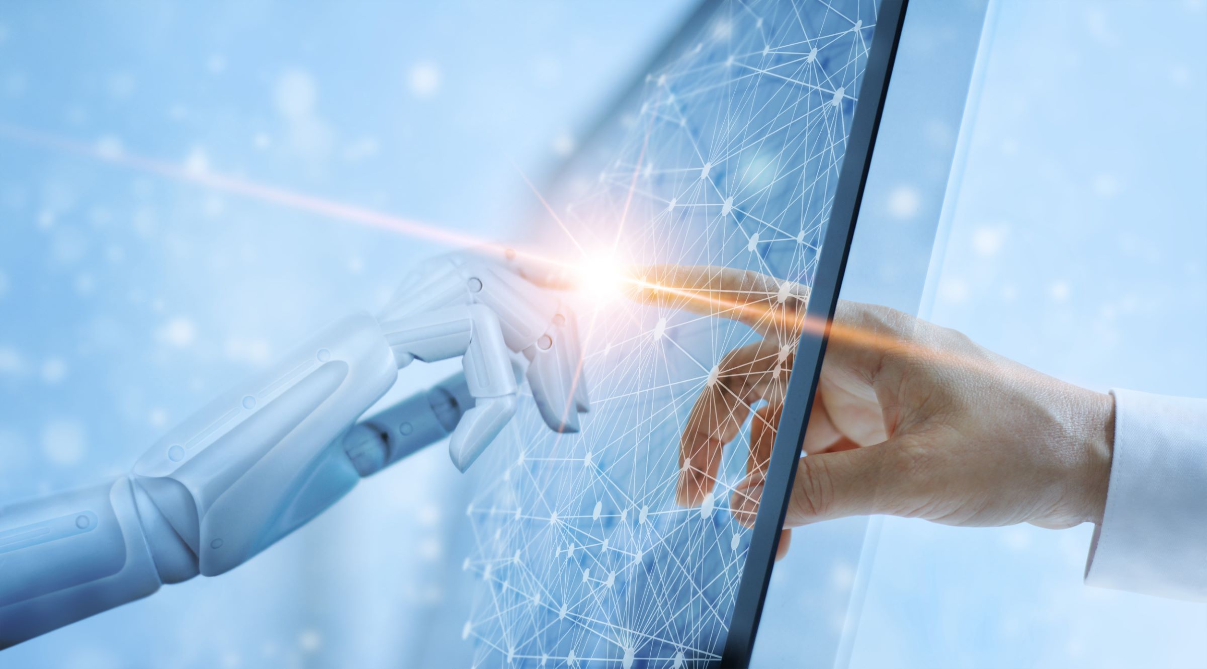 Hands of robot and human touching on digital interface