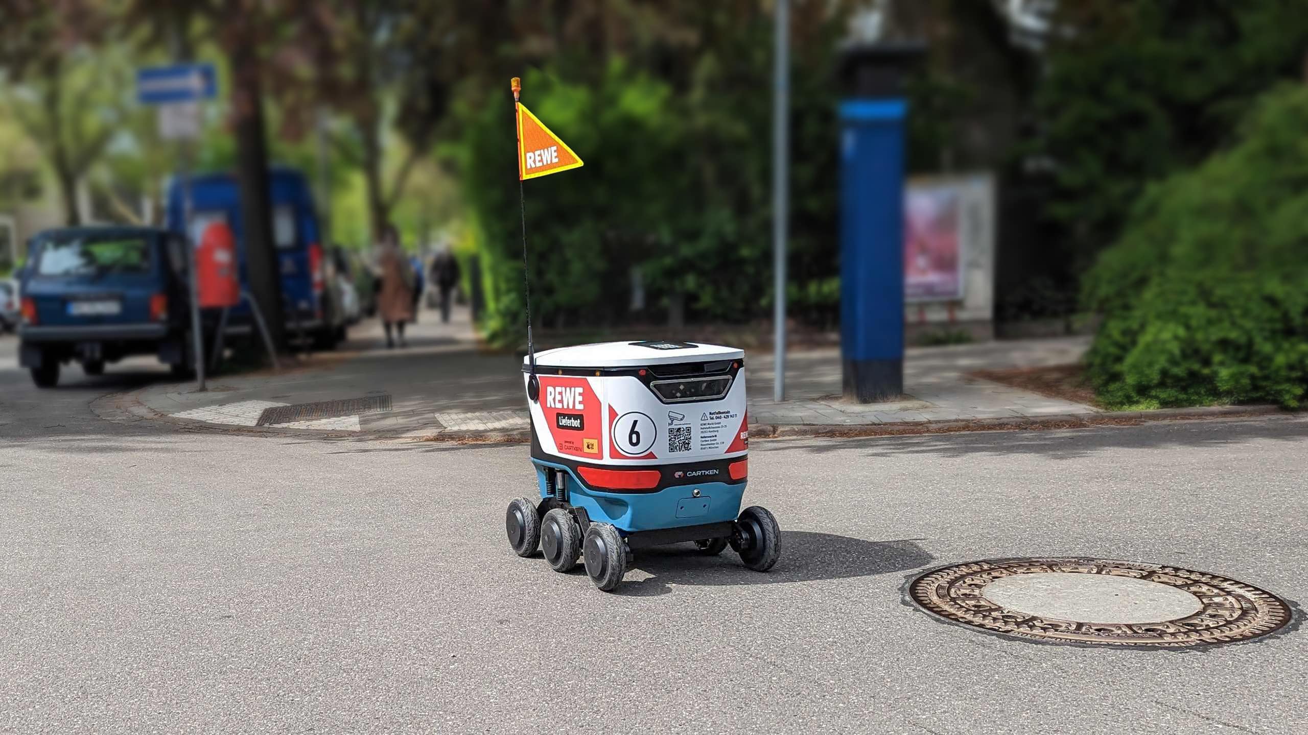 The REWE Delivery Bot driving on a street