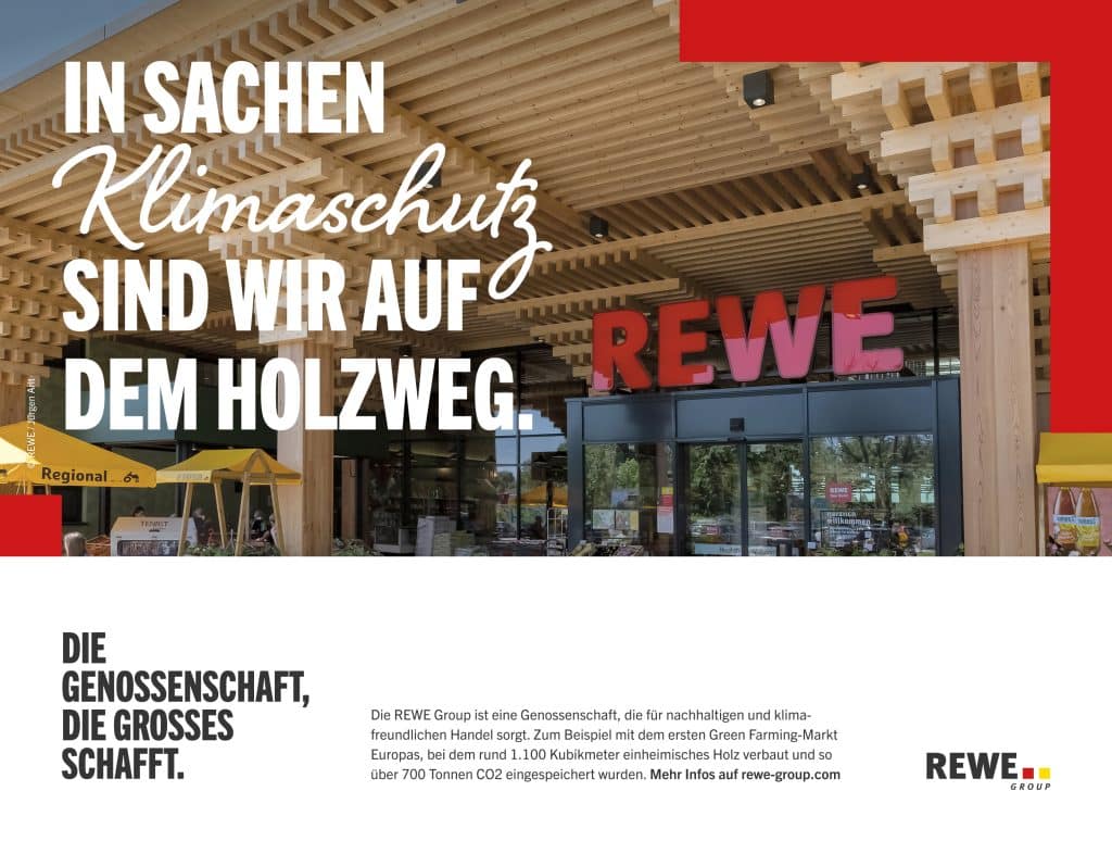 Greenbuilding von REWE mit Pflanzen die zum Verkauf angeboten werden und dem Schriftzug 