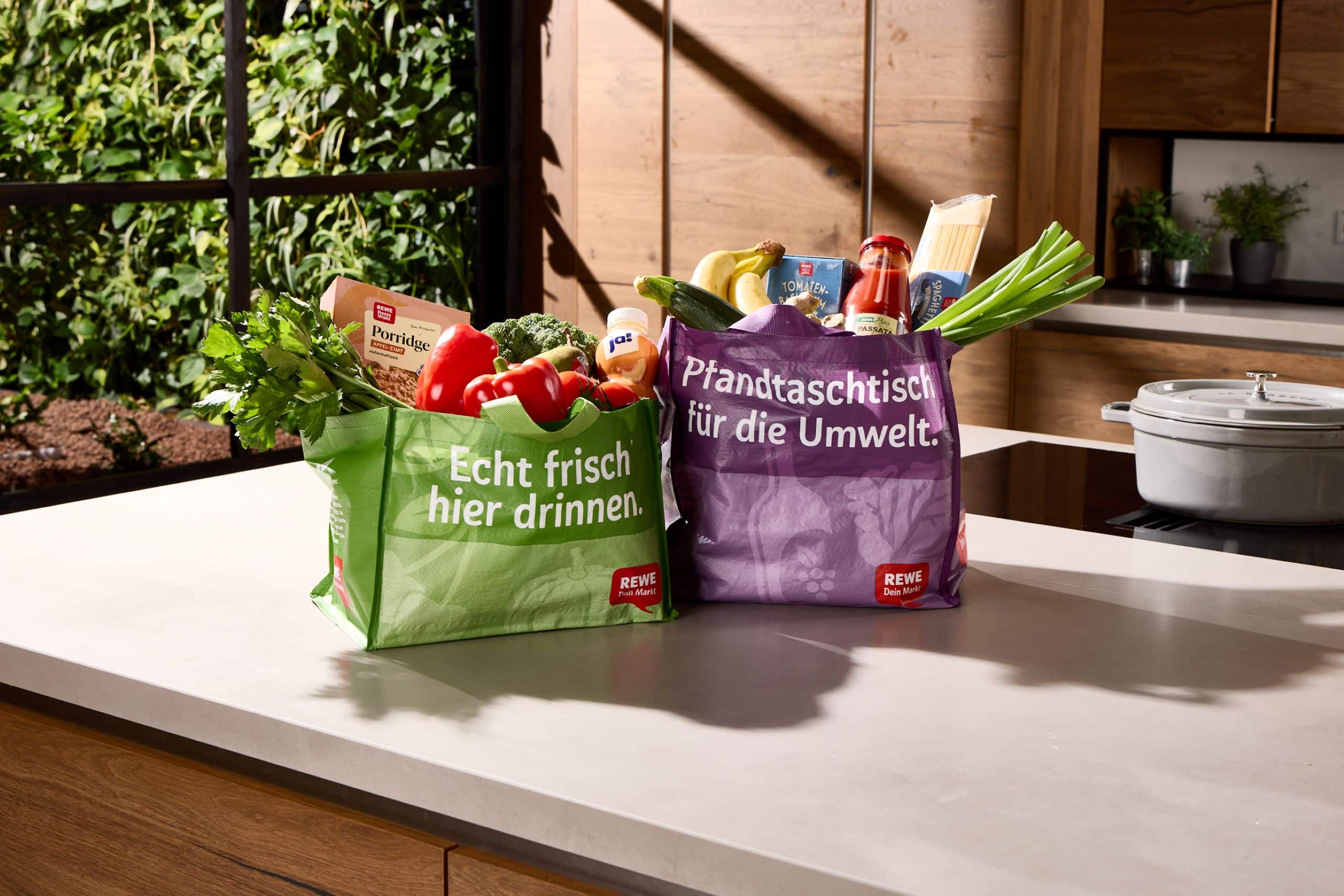 Filled shopping bags on a kitchen worktop
