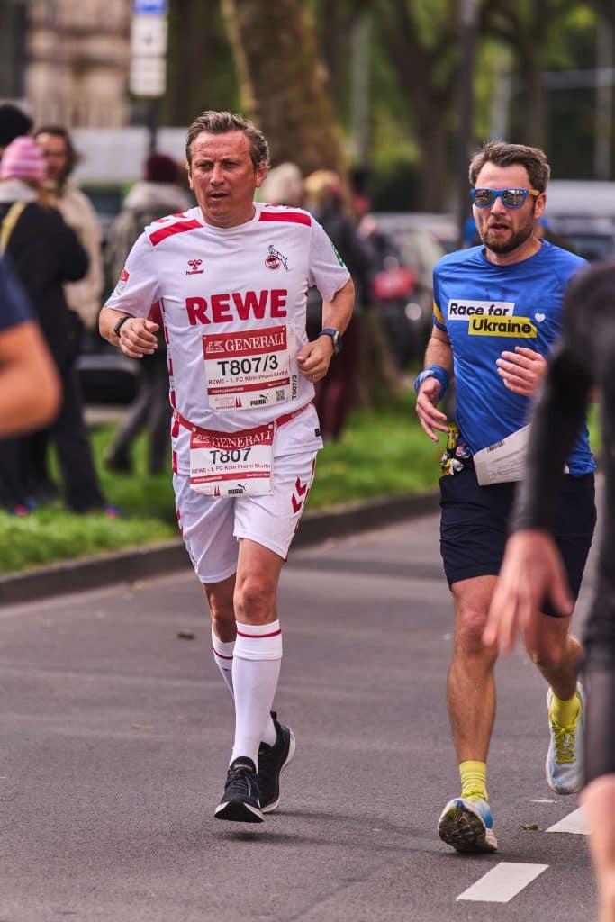 Lionel Souque, CEO der REWE Group, beim Köln Marathon als Läufer.