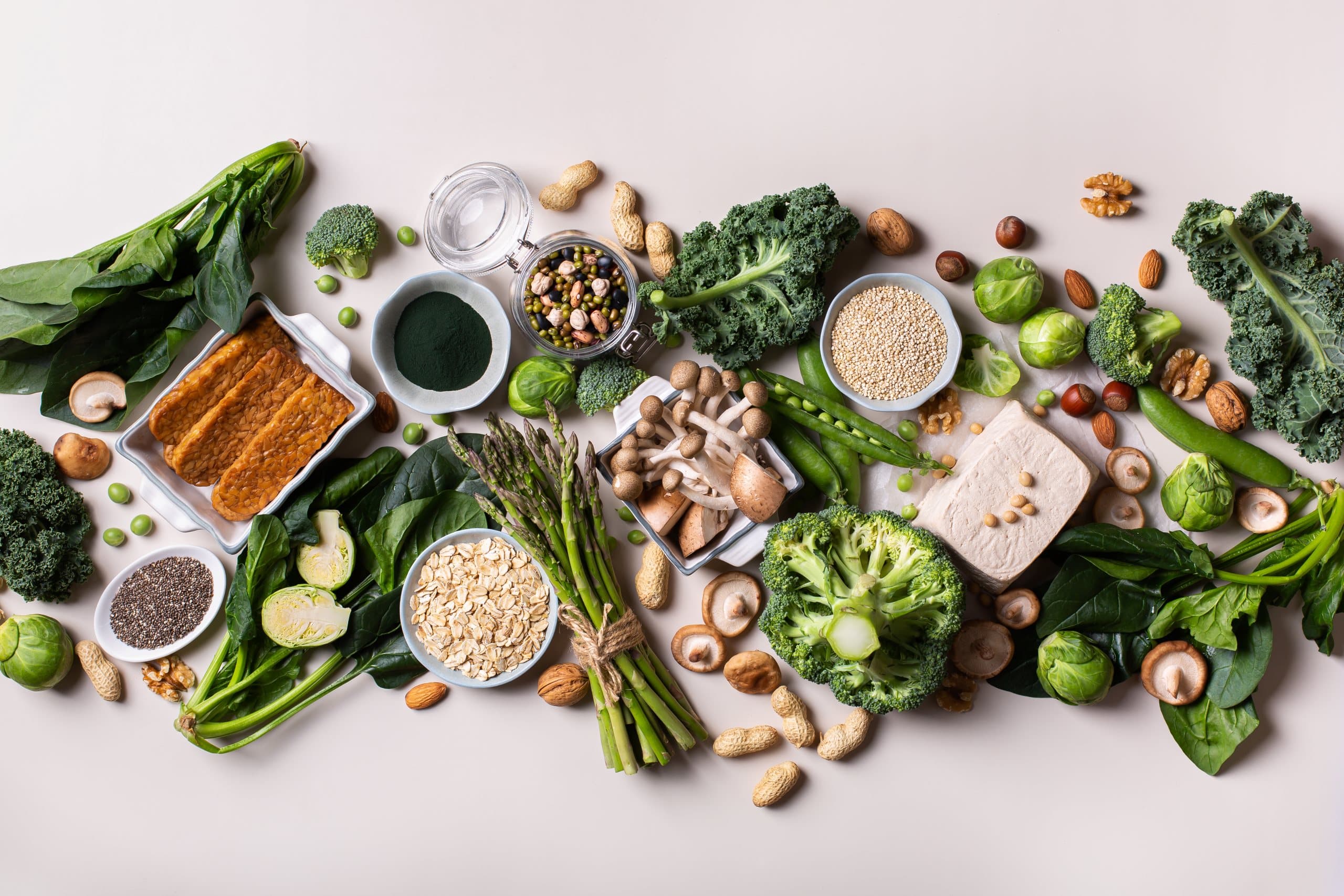 Plant-based foods with a high protein content are laid out next to each other.