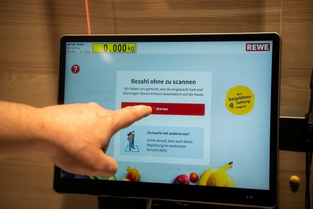 The image shows a screen in the supermarket displaying the message 