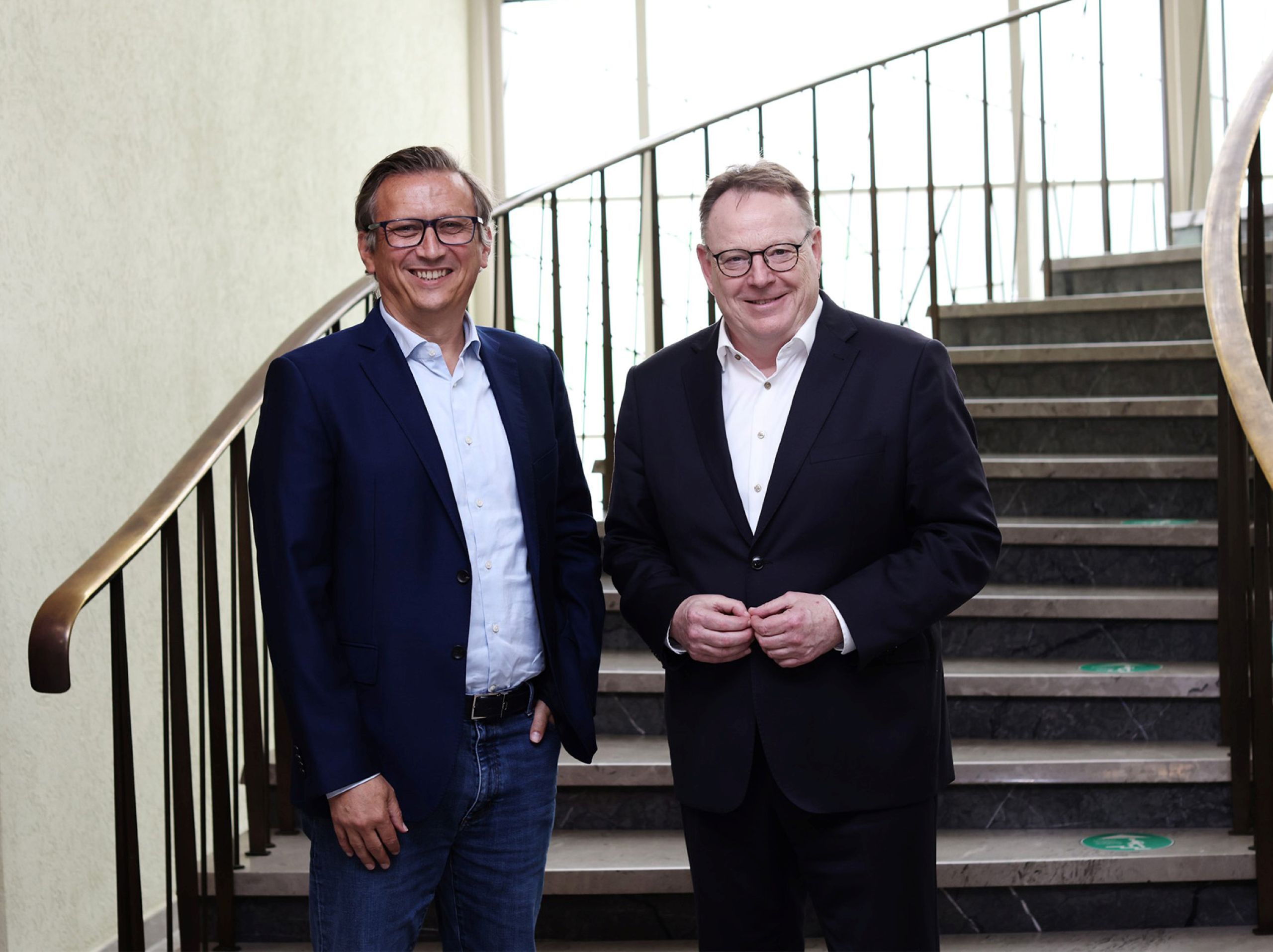 Portrait of Torsten Burmester, Mayor of Cologne, and Lionel Souque, CEO of the REWE Group